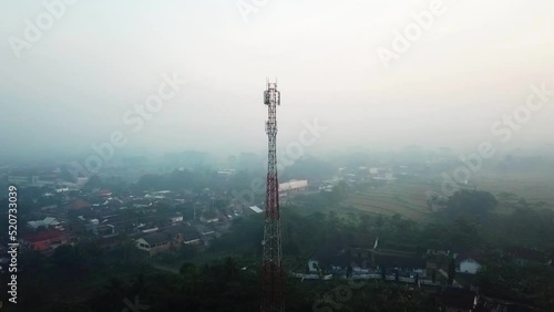 cellular tower on the countryside of Indonesia with foggy weather. telecommunications network support facilities. 4K clips.