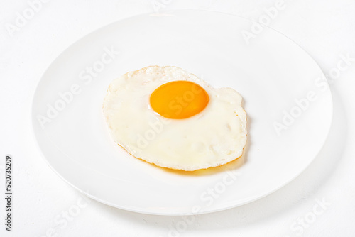 fried egg on the white plate