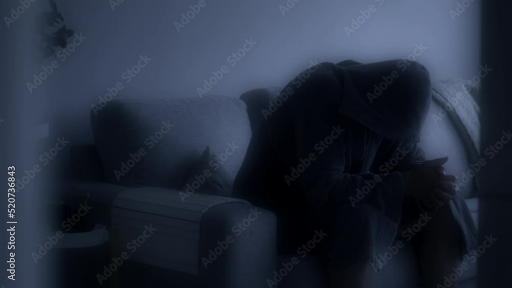 Evanescent scene of a depressed man in a bathrobe on the couch. Black and white. Static view Evanescent scene of a depressed man in a bathrobe on the couch. Black and white. Static view