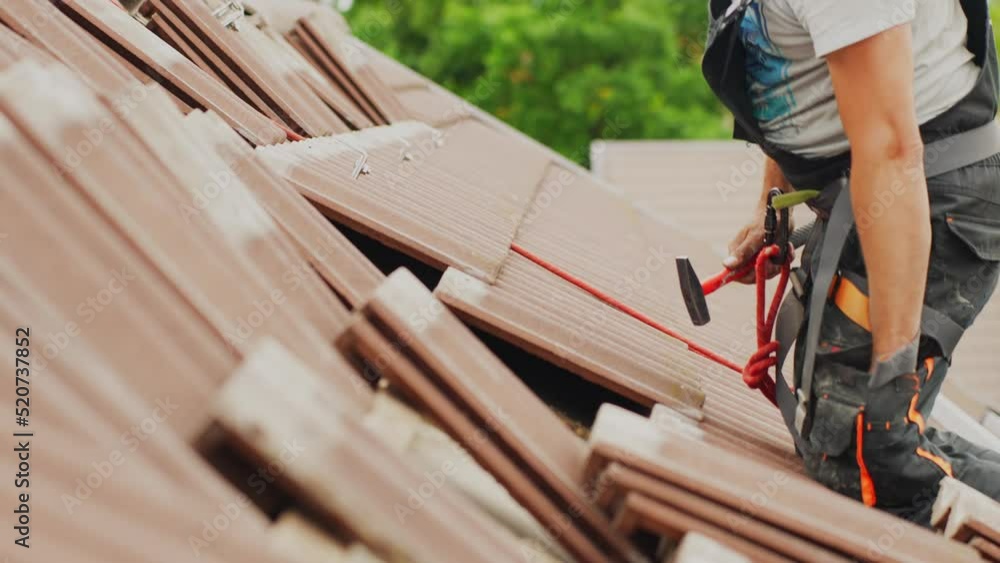 Roof tile installation process, hard work concept Roof tile installation process, hard work concept
