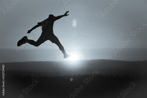 The silhouette of a man is jumping forward. The concept of clawing through hurdles © Stock Photo For You
