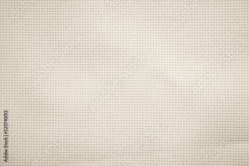 Fabric canvas woven texture background in pattern in light beige cream brown color.