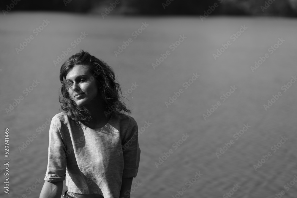 Outdoors portrait of young woman in black and white Outdoors portrait of young woman in black and white