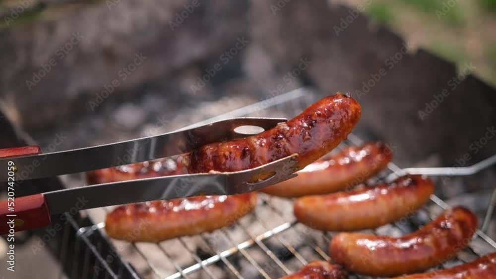 close-up view of tasty sausages grilling on charcoal grill grate close-up view of tasty sausages grilling on charcoal grill grate