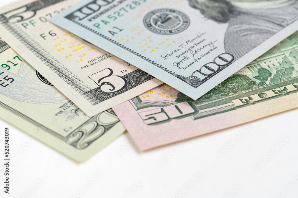 5, 20, 50, 100 dollars banknotes at different angles. Close up of dollars on white background. 5, 20, 50, 100 dollars banknotes at different angles. Close up of dollars on white background.