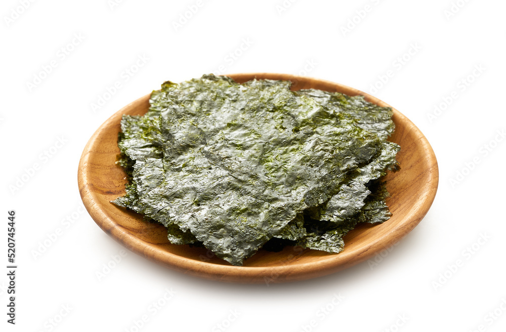 roasted nori laver seaweed snack in wood plate isolated on white