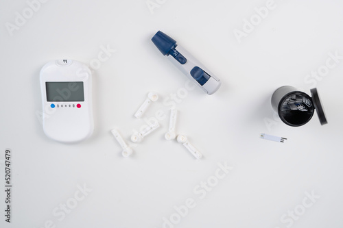 Home blood glucose test kit. Glucometer, lancet pen, needles and text strips.