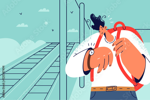 Stressed man check time worried about train delay 