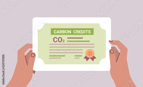 human hand CO2 limit emissions certificate net zero emission carbon credit offset concept