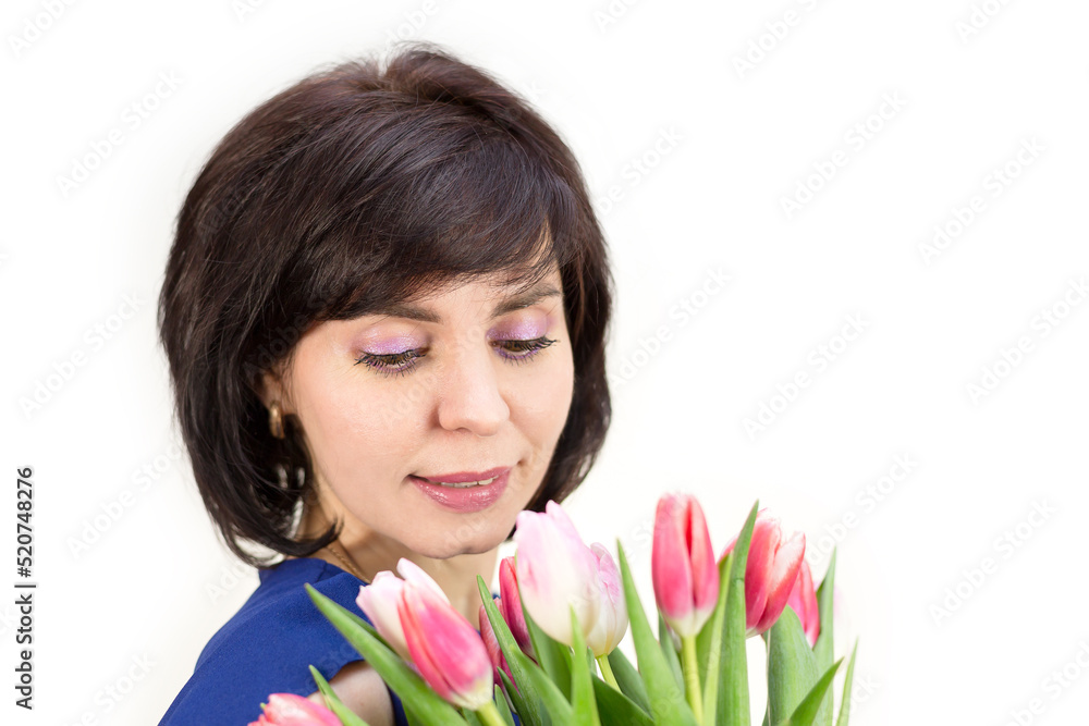 A young mother received flowers as a gift for her birthday. Isolated, white background. A young mother received flowers as a gift for her birthday. Isolated, white background.