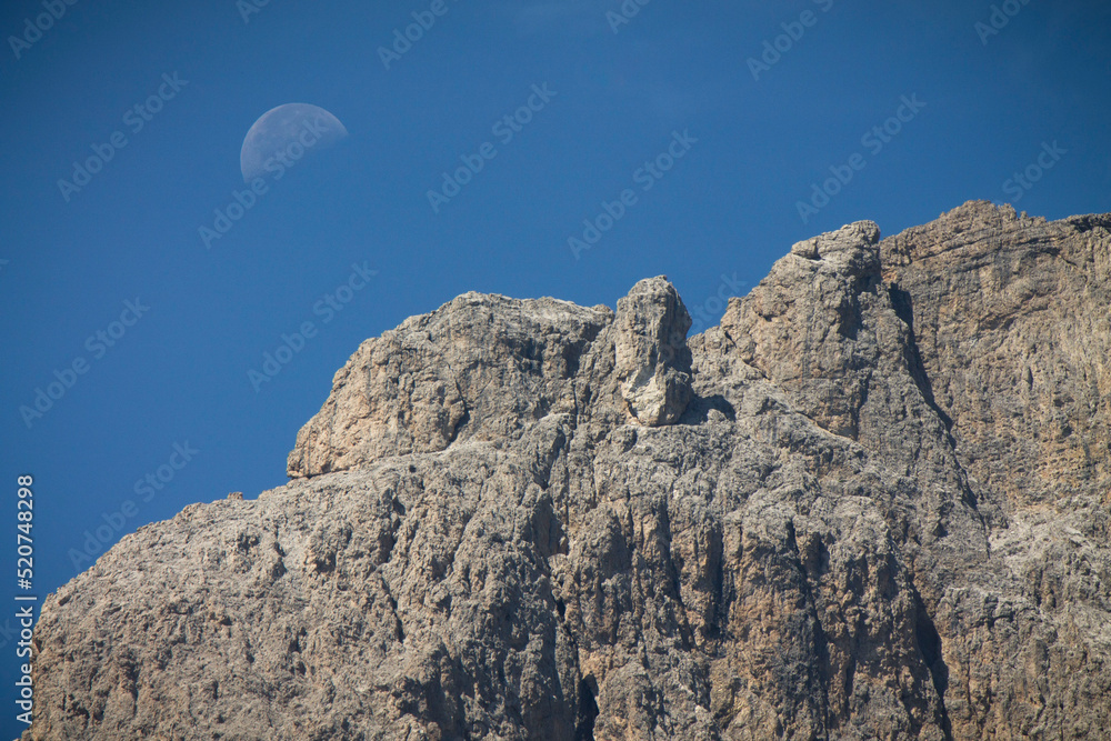 landscape with moon in blue sky on dolomites landscape with moon in blue sky on dolomites