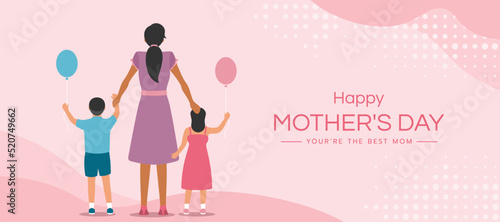 Happy mother's day - son and daughter stand back hold mother s hand and hold balloons on soft pink background vector design