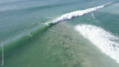 Aerial View Of Surfers Surinf At The Palm Beach In QLD, Australia. - pullback photo