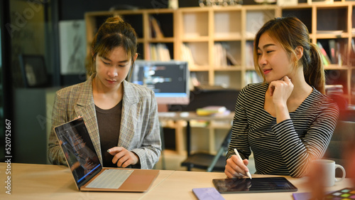Two female IT developer working together for developing new software at corporate office