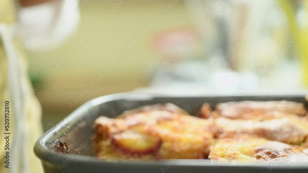 The cook takes a piece of easy plum cake.
The cook takes a piece of easy plum cake.