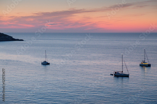 veleros fondeados frente a Cala Xarraca, Ibiza, balearic islands, Spain photo