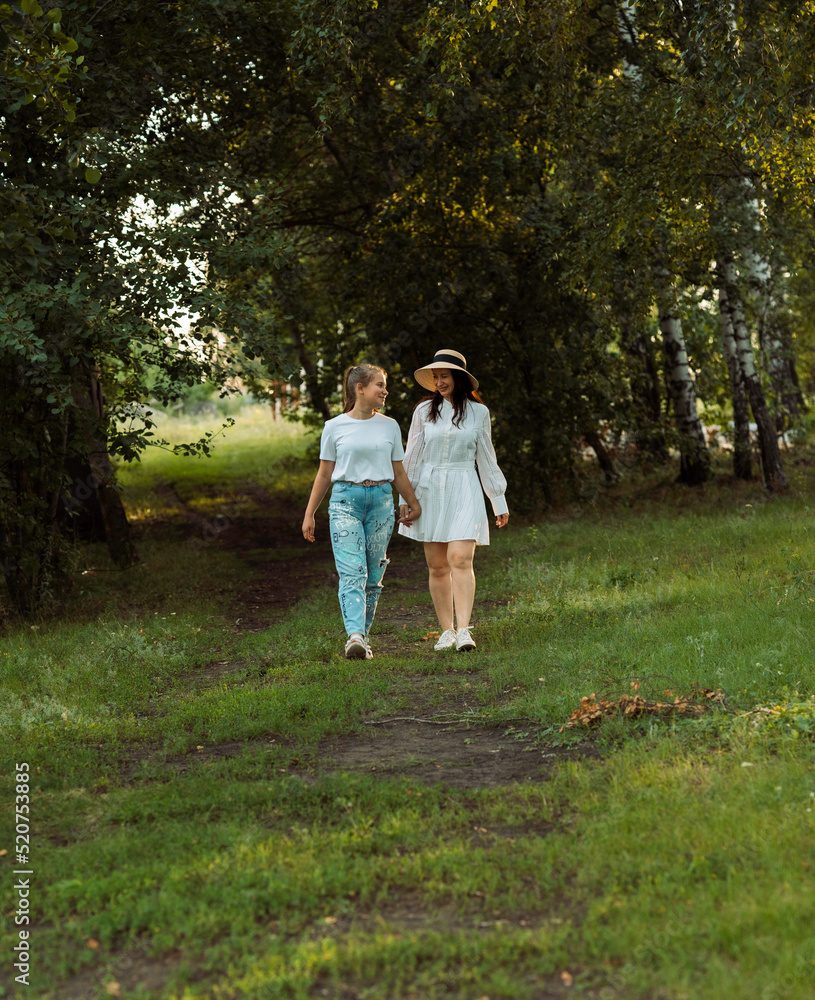 family walk in the nature of mother and daughter