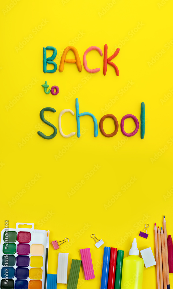 letters made of multi-colored plasticine back to school and watercolor paints, colored plasticine, paper clips, felt-tip pens, glue, pencils on yellow background, vertical letters made of multi-colored plasticine back to school and watercolor paints, colored plasticine, paper clips, felt-tip pens, glue, pencils on yellow background, vertical