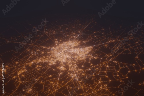 Aerial shot of Faisalabad (Pakistan) at night, view from north. Imitation of satellite view on modern city with street lights and glow effect. 3d render