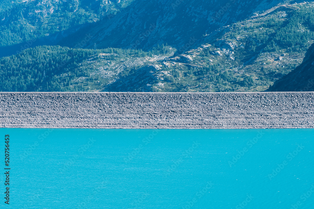 Artificial dam and lake on Col de Mont Cenis, France. Hydroelectric power plant