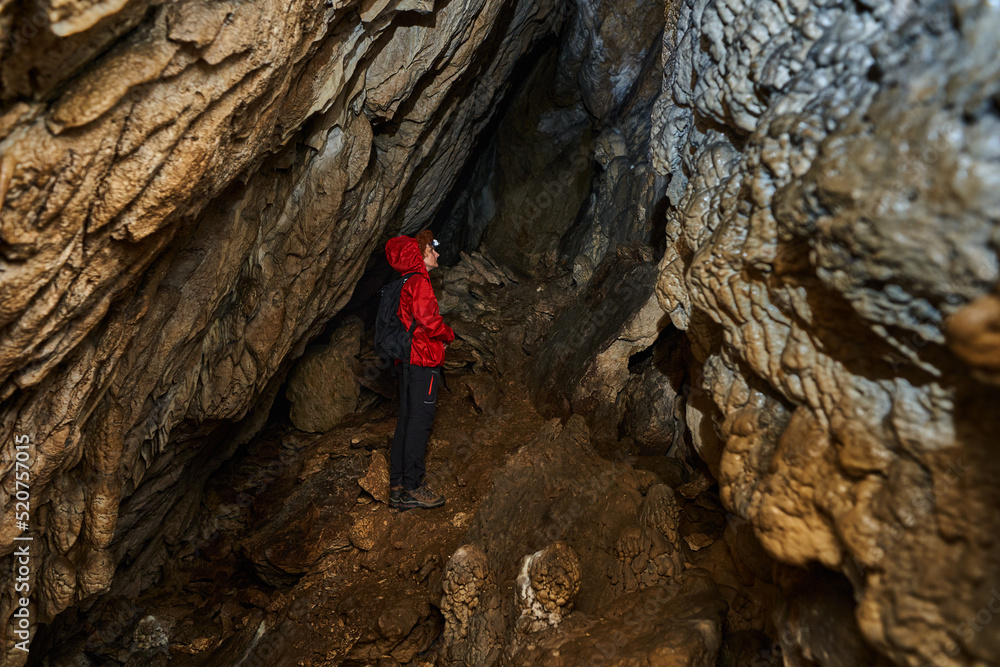 Woman explorer in a cave