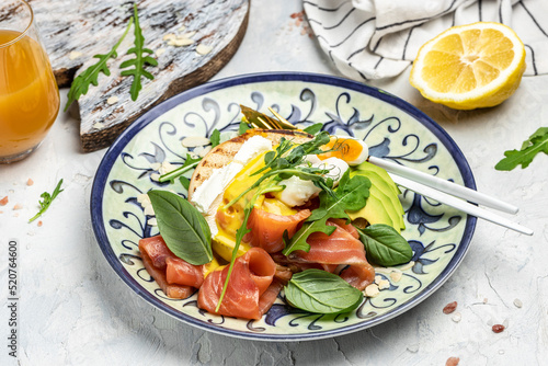 keto breakfast diet avocado and Poached Egg, cheese, salmon and fresh salad, fresh juice, Keto breakfast or lunch. Food recipe background. Close up
