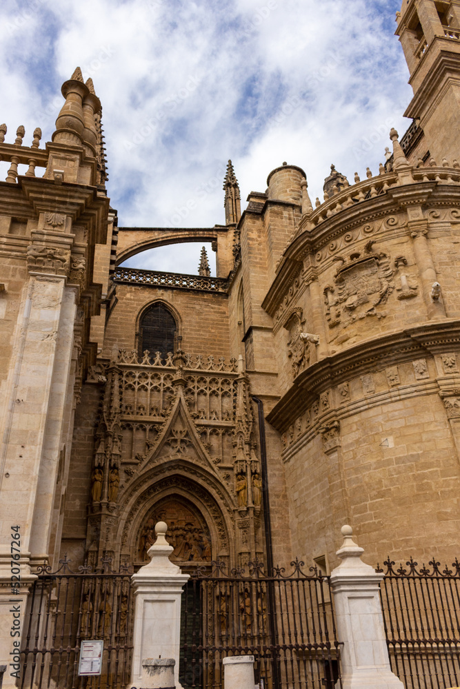 Seville, Spain, September 11, 2021: Detail of the Main door of the Assumption of Saint Mary of the See Cathedral, is well-preserved and elaborately decorated in the center of the west facade.