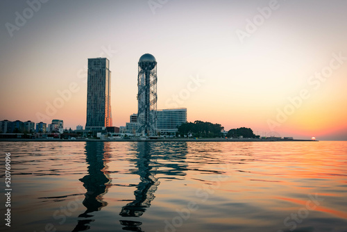 Panoramic view of Iveria beach and Batumi landmarks with sunrise in the background. Travel destination in Georgia republic. photo