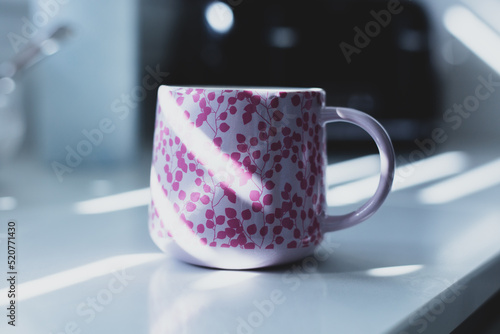 Pink cup on the kitchen table