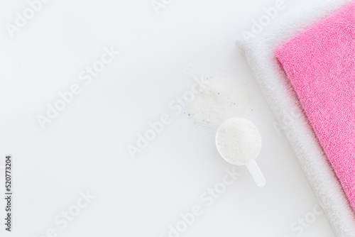 Laundry detergents powder with scoop and fresh towels