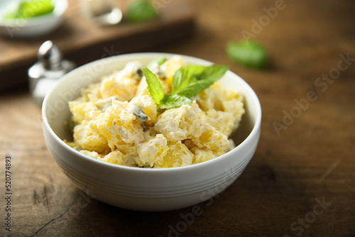 Traditional homemade potato salad with gherkins	