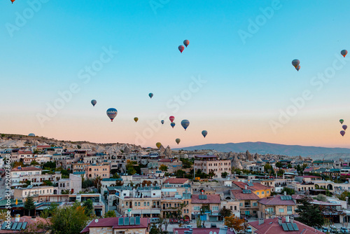 hot air balloons rising into sky, concept of must see travel destination, bucket list trip