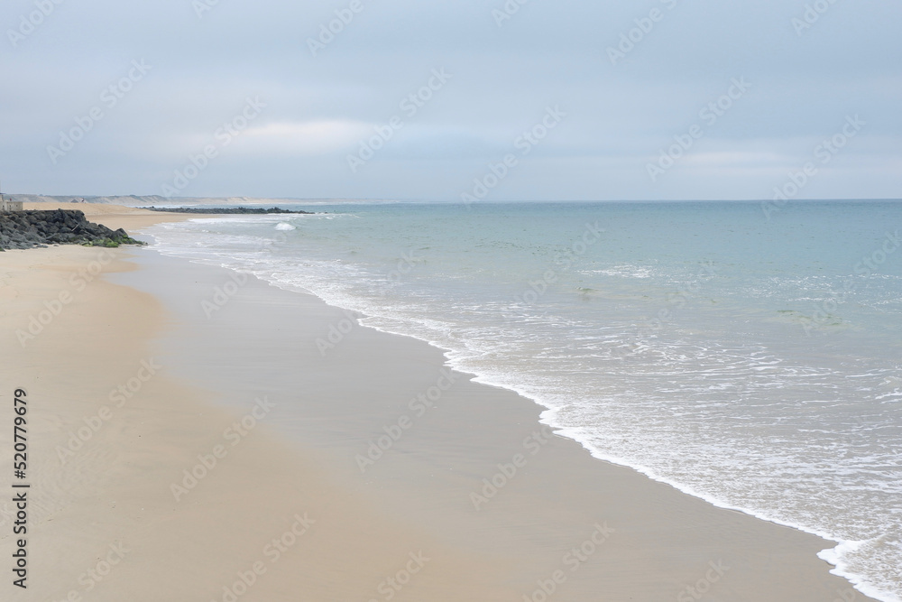 Empty ocean beach landscape of faded calm colours in France