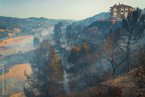 Smoke from fires rises from the countryside of Bufalvent, in the Catalonia region, where numerous wildfires have been raging during a prolonged heatwave in Manresa, Spain on July 18, 2022