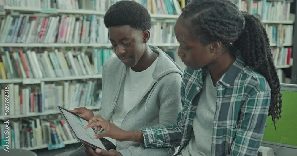University Students using Digital Tablet in Library University Students using Digital Tablet in Library
