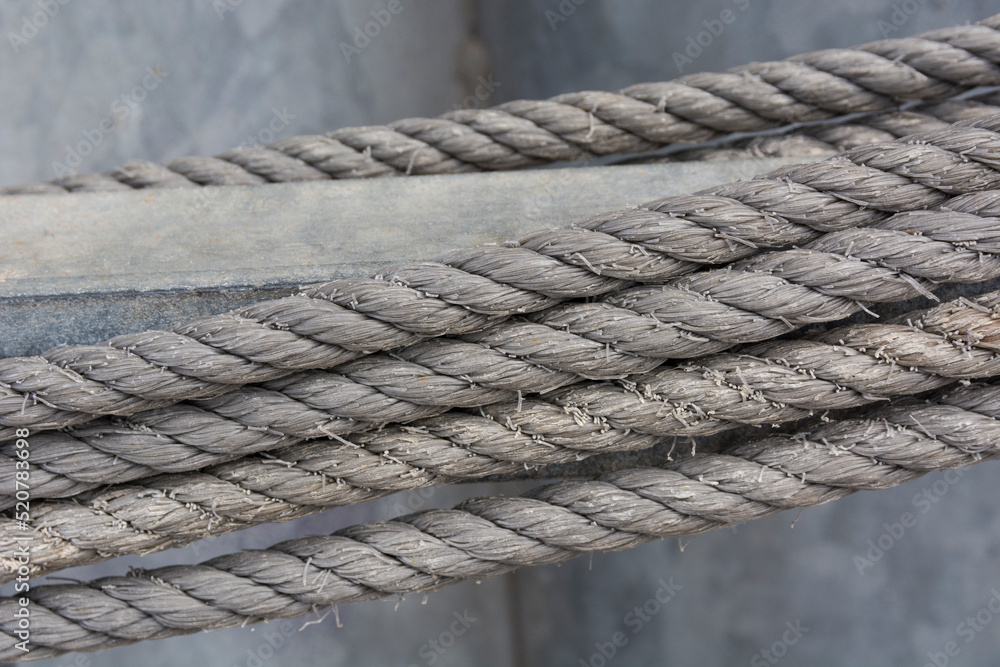Five ropes with gray background on fishing boat. Abstract. Strength. Motivation. Business Five ropes with gray background on fishing boat. Abstract. Strength. Motivation. Business