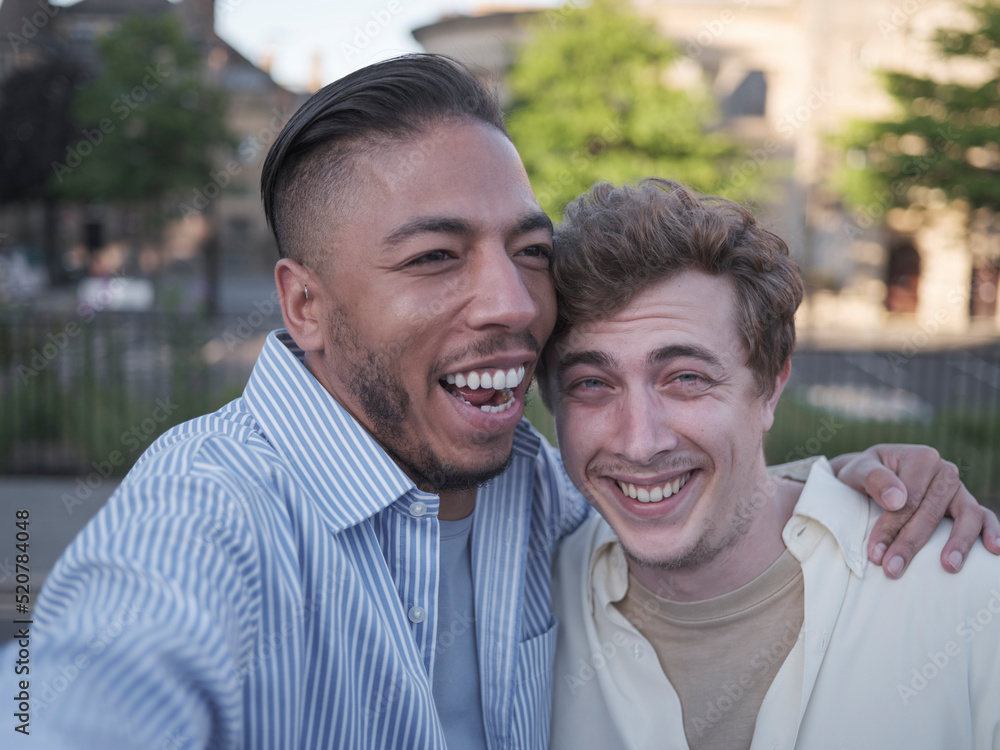 Fototapeta premium UK, South Yorkshire, Portrait of smiling gay couple embracing outdoors