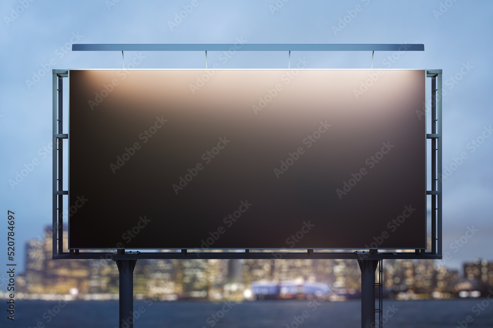 Blank black billboard on cityscape background at evening, front view. Mock up, advertising concept Blank black billboard on cityscape background at evening, front view. Mock up, advertising concept