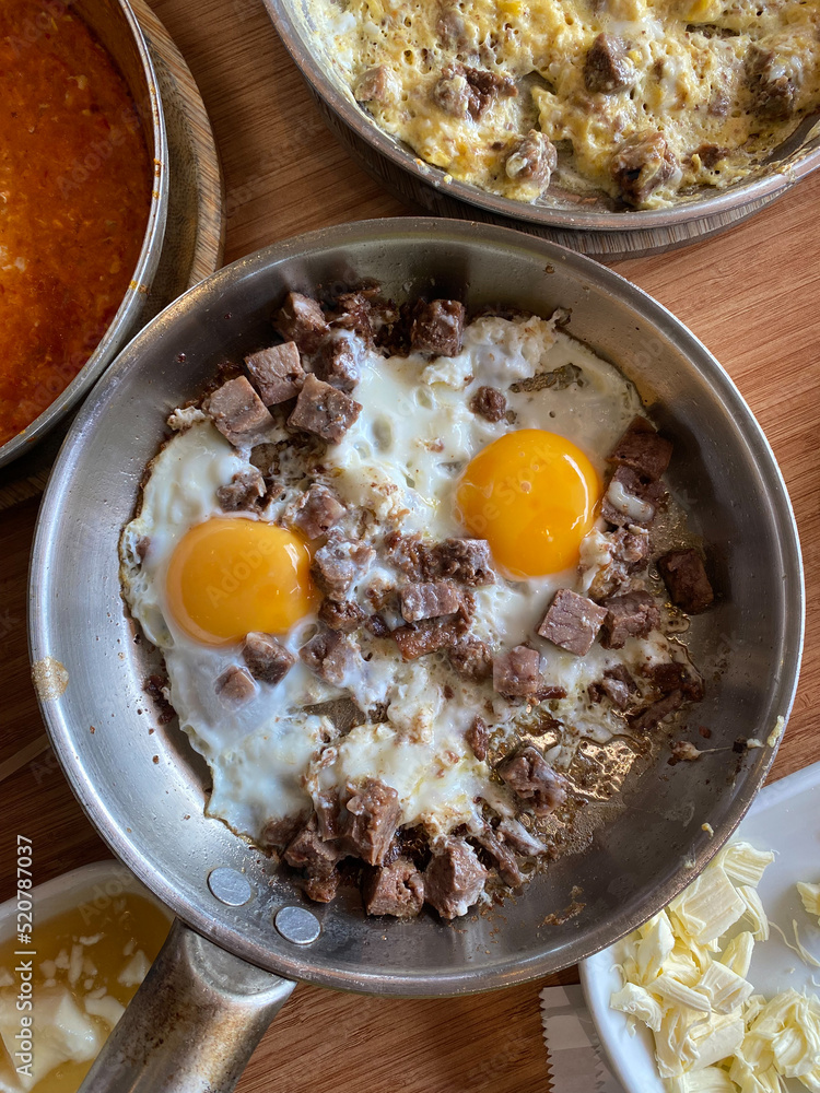 Turkish Style Fried Sunny Side Up Eggs with Meat Kavurma. Turkish Style Fried Sunny Side Up Eggs with Meat Kavurma.