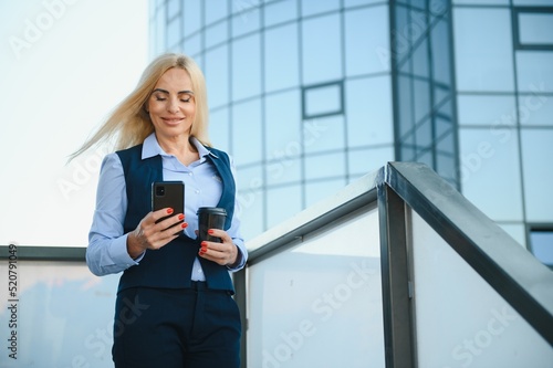 Portrait of a business woman using a cell phone