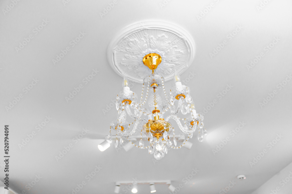 Beautiful ceiling lamp with glass beads and gold decor. 