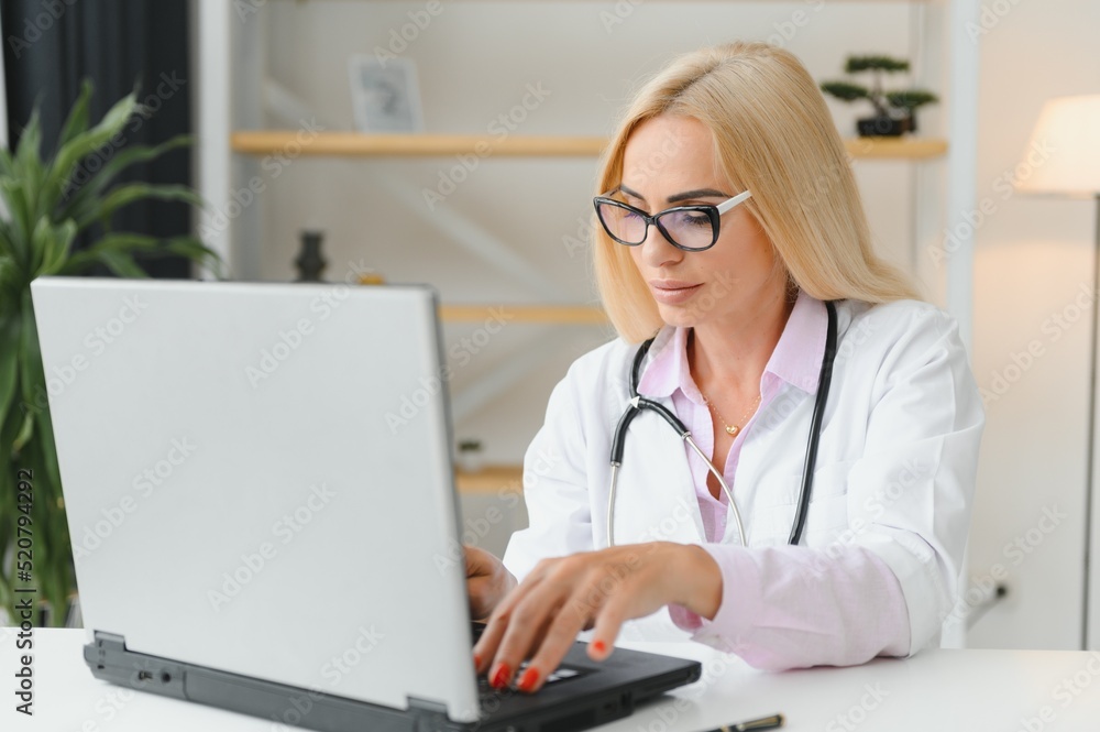 Middle age woman wearing doctor uniform at clinic Middle age woman wearing doctor uniform at clinic