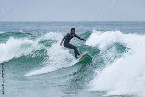 Surfer girl riding a wave