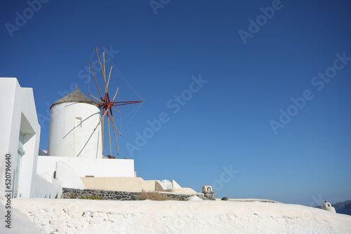a windmill in santorini island, greece