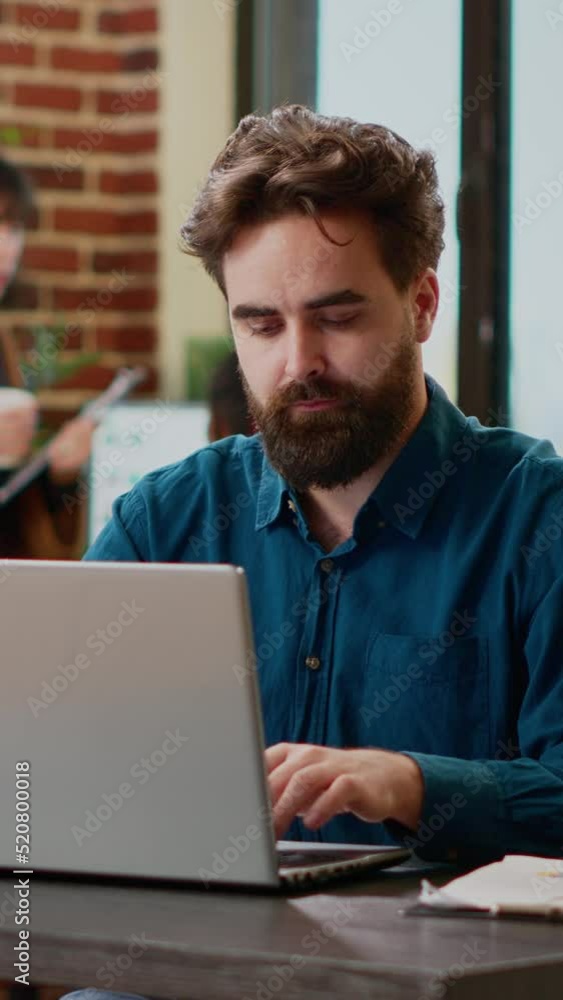 Vertical video: Portrait of project manager sending professional email on laptop, working online to plan networking presentation with business charts and graphs. Analyzing research information at work Vertical video: Portrait of project manager sending professional email on laptop, working online to plan networking presentation with business charts and graphs. Analyzing research information at work