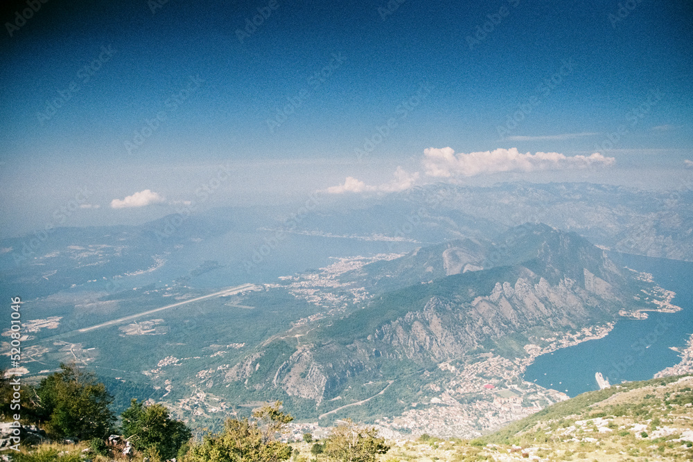 Panoramic view of Kotor Gorge in Montenegro. Grainy film in the style of old photos