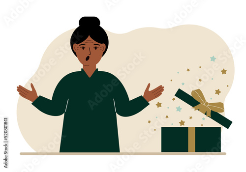 A woman next to an open gift. The concept of a holiday, surprise, promotion, discount.
