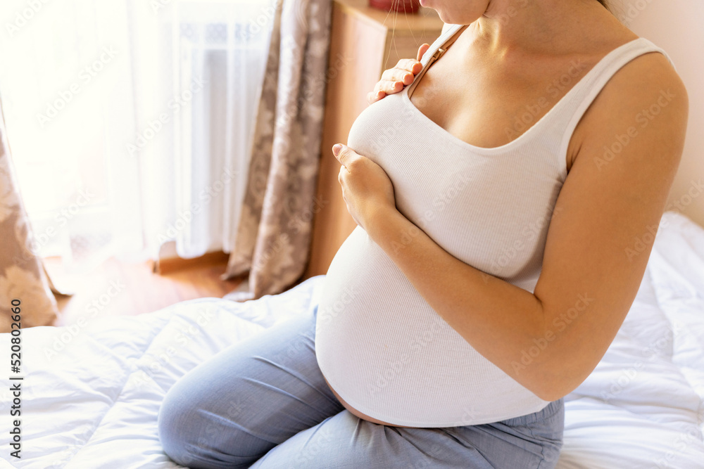 Breast test cancer pregnancy woman check. Happy young pregnant woman self exam. Breast self exam BSE, breast cancer awareness concept. Breast test cancer pregnancy woman check. Happy young pregnant woman self exam. Breast self exam BSE, breast cancer awareness concept.