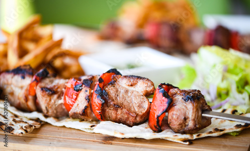 tasty greek souvlaki skier with fresh vegetables