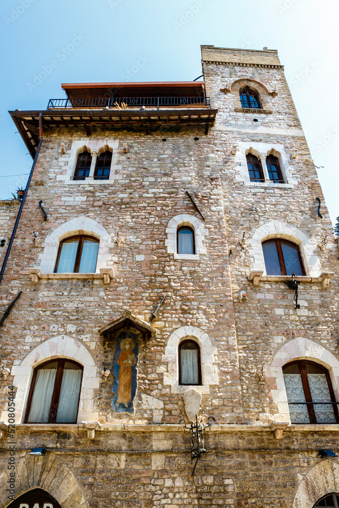 Facade of an old building in the historic center of Assisi, Umbria, Italy, Europe